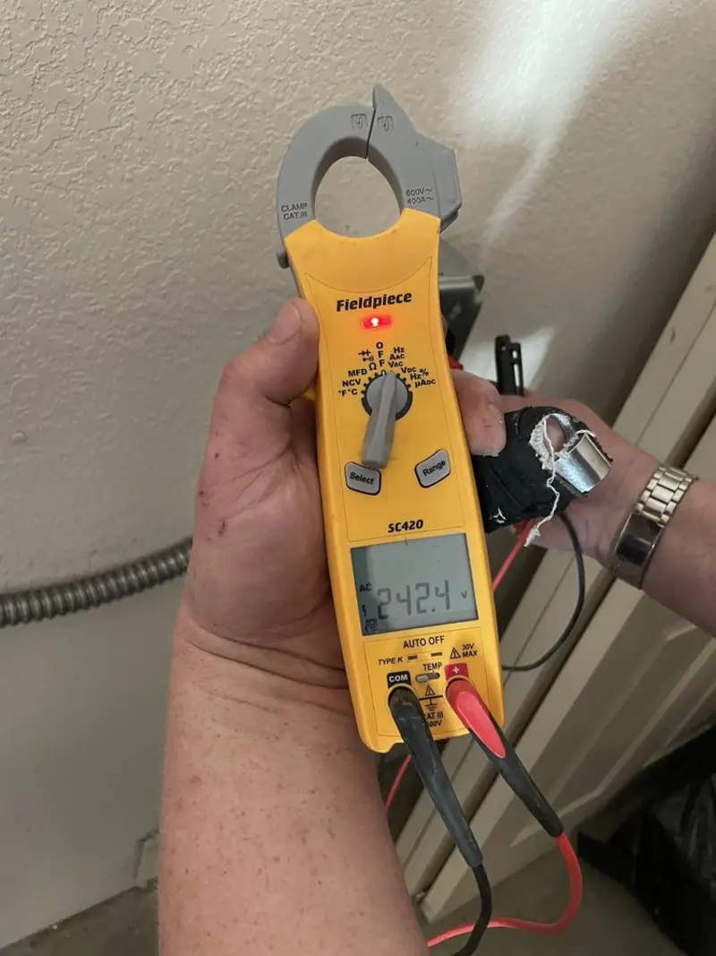 Voltage testing with clamp meter during Electrical Installation Services in Sanford